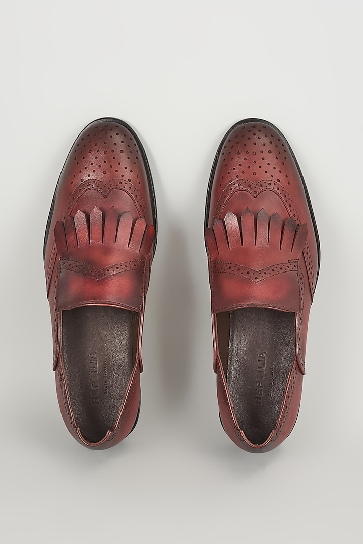 Burgundy Leather Brogue Wingtip Kiltie Slip-On Shoes by SALIL BHATIA at Pernia's Pop Up Shop