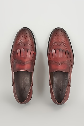 Burgundy Leather Brogue Wingtip Kiltie Slip-On Shoes by SALIL BHATIA