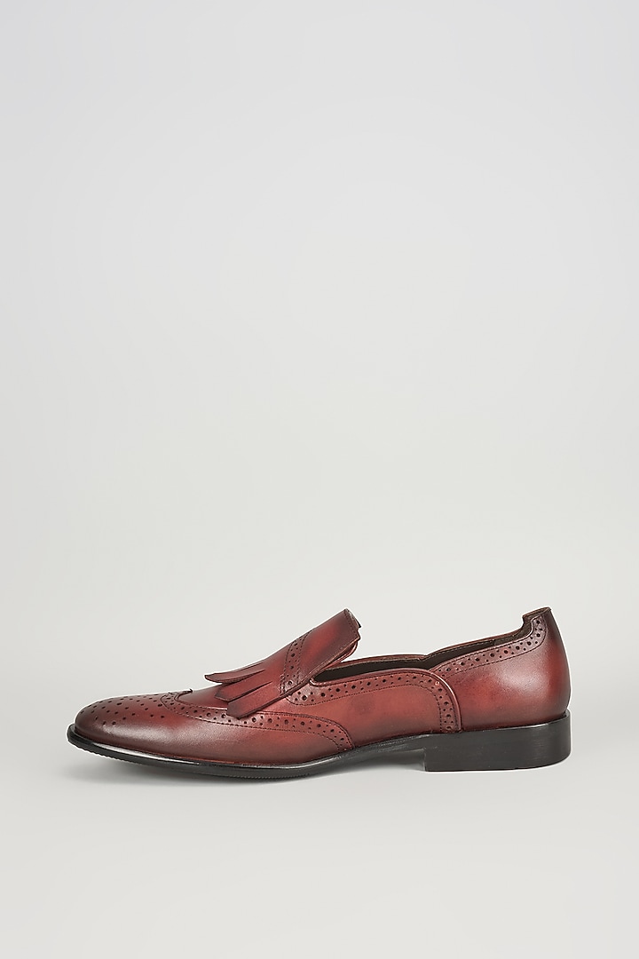 Burgundy Leather Brogue Wingtip Kiltie Slip-On Shoes by SALIL BHATIA at Pernia's Pop Up Shop