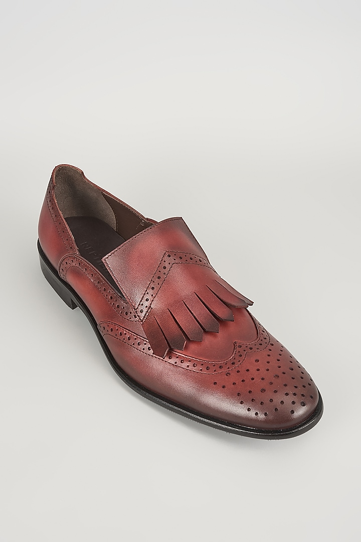 Burgundy Leather Brogue Wingtip Kiltie Slip-On Shoes by SALIL BHATIA at Pernia's Pop Up Shop