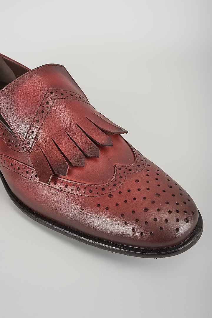 Burgundy Leather Brogue Wingtip Kiltie Slip-On Shoes by SALIL BHATIA at Pernia's Pop Up Shop