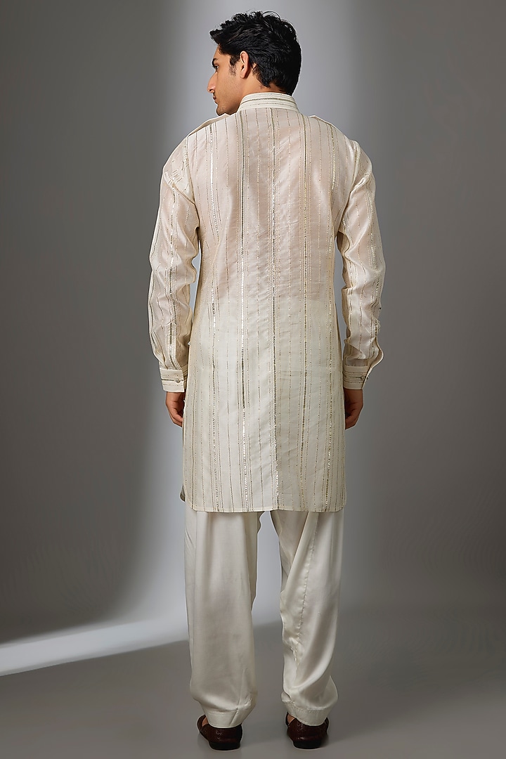 Ivory Chanderi & Modal Satin Embroidered Pathani Kurta Set by SALIL BHATIA at Pernia's Pop Up Shop