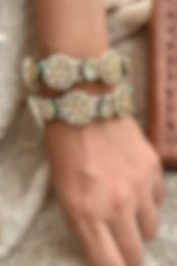 Gold Finish Kundan Polki & Pearl Bangles (Set Of 2) by Saga Jewels at Pernia's Pop Up Shop