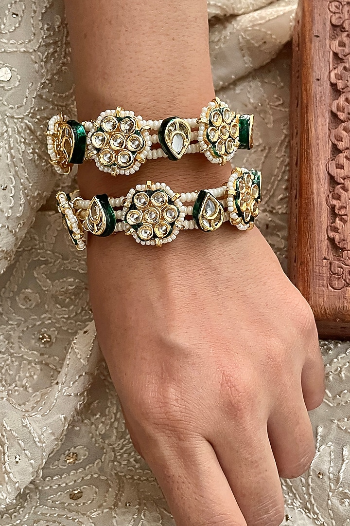 Gold Finish Kundan Polki & Pearl Bangles (Set Of 2) by Saga Jewels at Pernia's Pop Up Shop