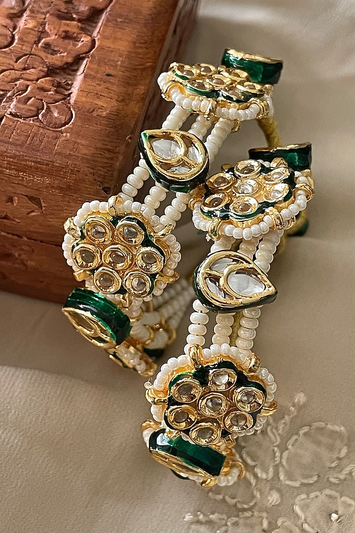 Gold Finish Kundan Polki & Pearl Bangles (Set Of 2) by Saga Jewels at Pernia's Pop Up Shop