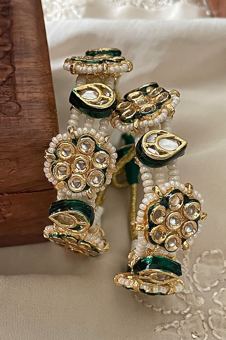 Gold Finish Kundan Polki & Pearl Bangles (Set Of 2) by Saga Jewels at Pernia's Pop Up Shop
