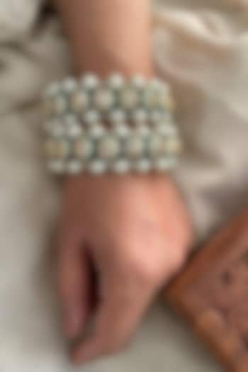 Gold Finish Kundan Polki & Pearl Bangles (Set Of 2) by Saga Jewels at Pernia's Pop Up Shop