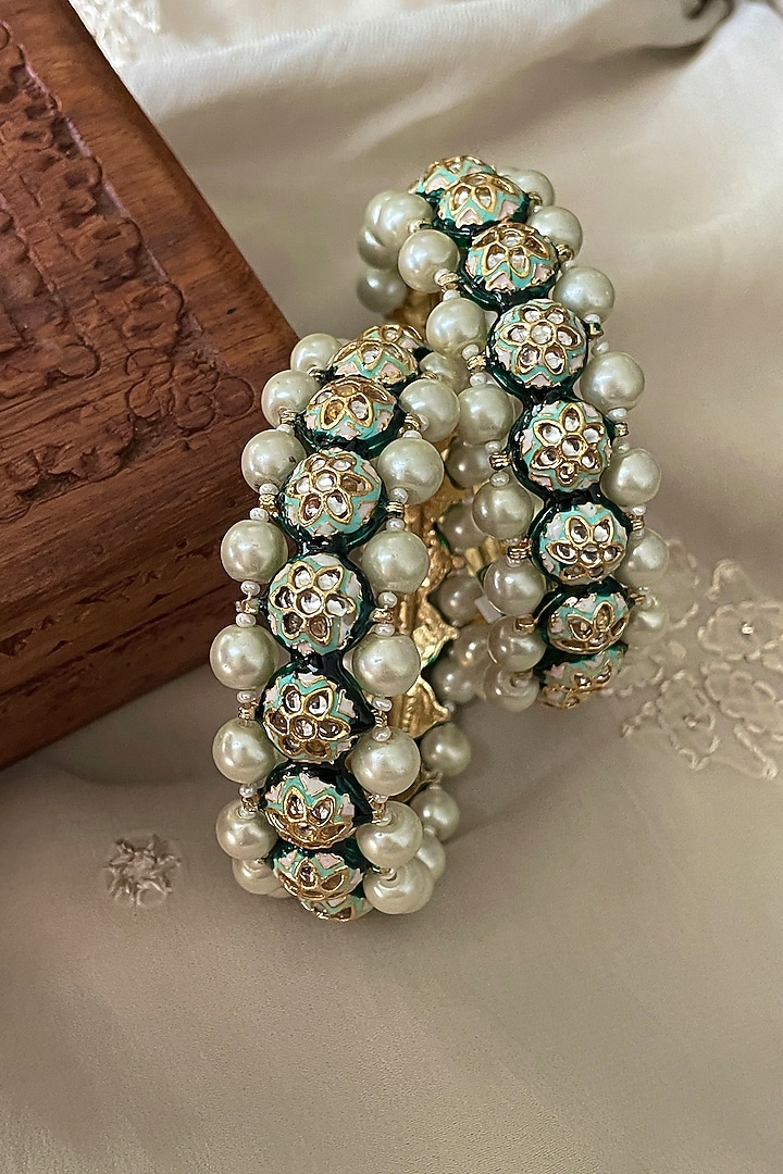 Gold Finish Kundan Polki & Pearl Bangles (Set Of 2) by Saga Jewels at Pernia's Pop Up Shop