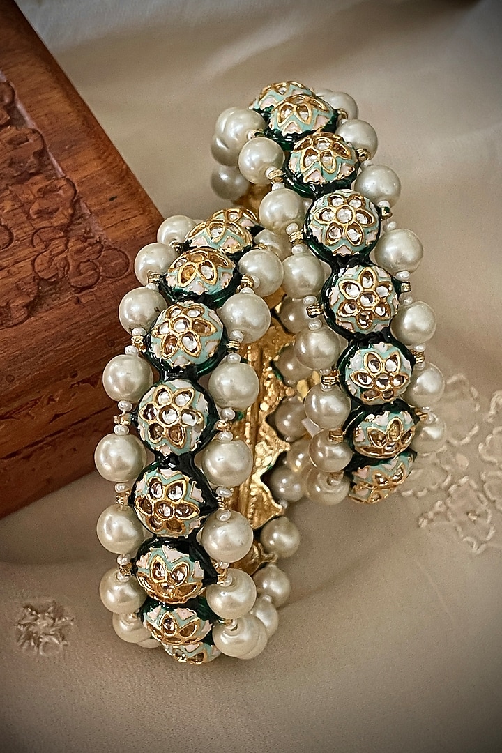 Gold Finish Kundan Polki & Pearl Bangles (Set Of 2) by Saga Jewels at Pernia's Pop Up Shop