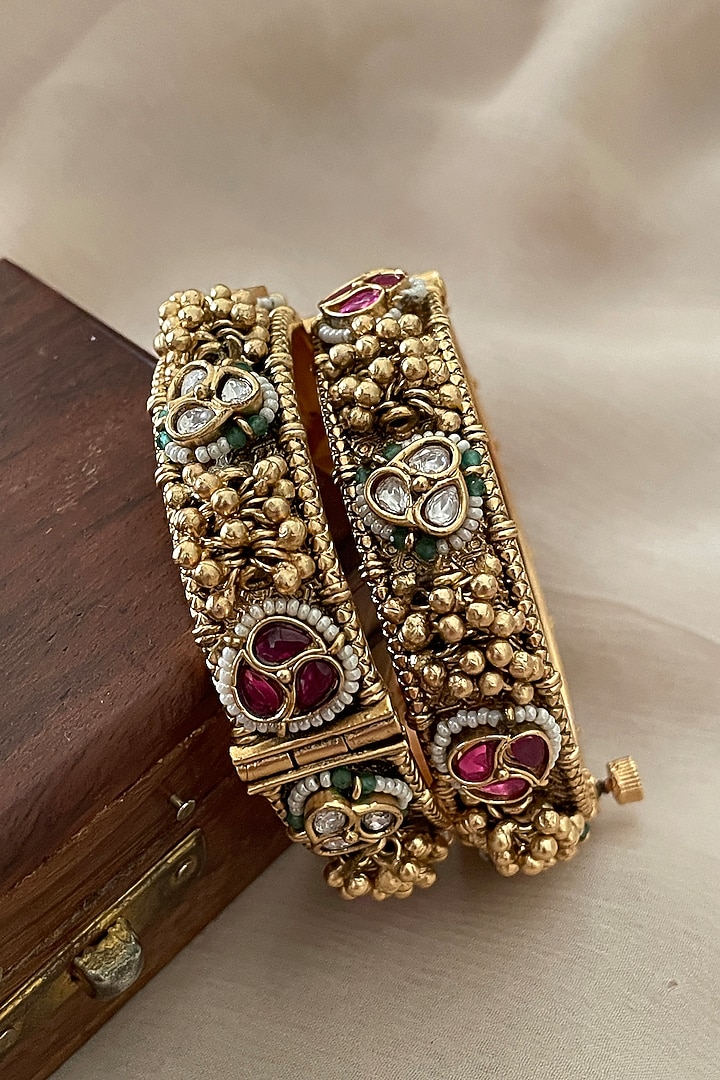 Gold Finish Kundan Polki & Ghungroo Temple Bangles (Set Of 2) by Saga Jewels at Pernia's Pop Up Shop
