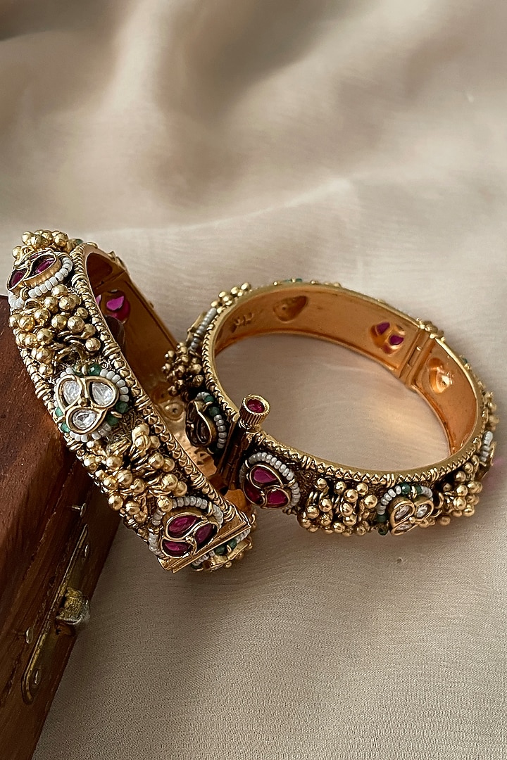 Gold Finish Kundan Polki & Ghungroo Temple Bangles (Set Of 2) by Saga Jewels at Pernia's Pop Up Shop