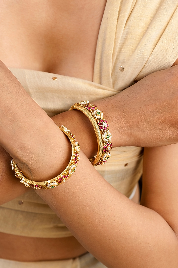 Gold Finish Pearl Temple Bangles (Set Of 2) by Saga Jewels at Pernia's Pop Up Shop