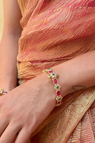 Gold Finish Red Stone & Floral Motif Bangles (Set Of 2) by Saga Jewels