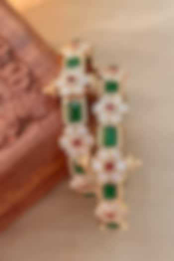 Gold Finish Green Stone & Floral Motif Bangles (Set Of 2) by Saga Jewels at Pernia's Pop Up Shop