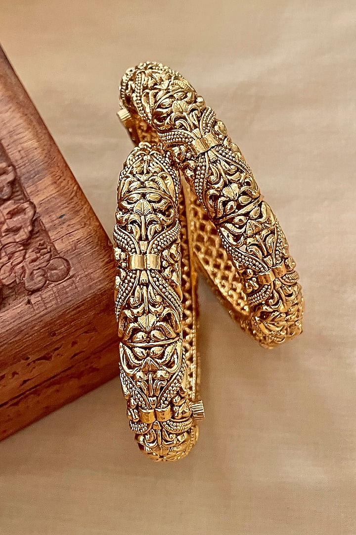 Gold Finish Temple Bangles (Set Of 2) by Saga Jewels at Pernia's Pop Up Shop