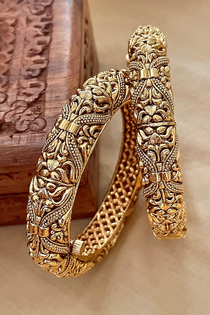 Gold Finish Temple Bangles (Set Of 2) by Saga Jewels at Pernia's Pop Up Shop
