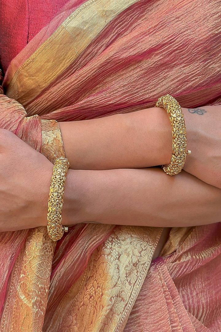 Gold Finish Temple Carved Bangles (Set Of 2) by Saga Jewels at Pernia's Pop Up Shop