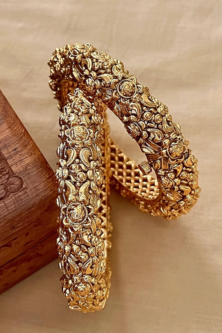 Gold Finish Temple Carved Bangles (Set Of 2) by Saga Jewels at Pernia's Pop Up Shop