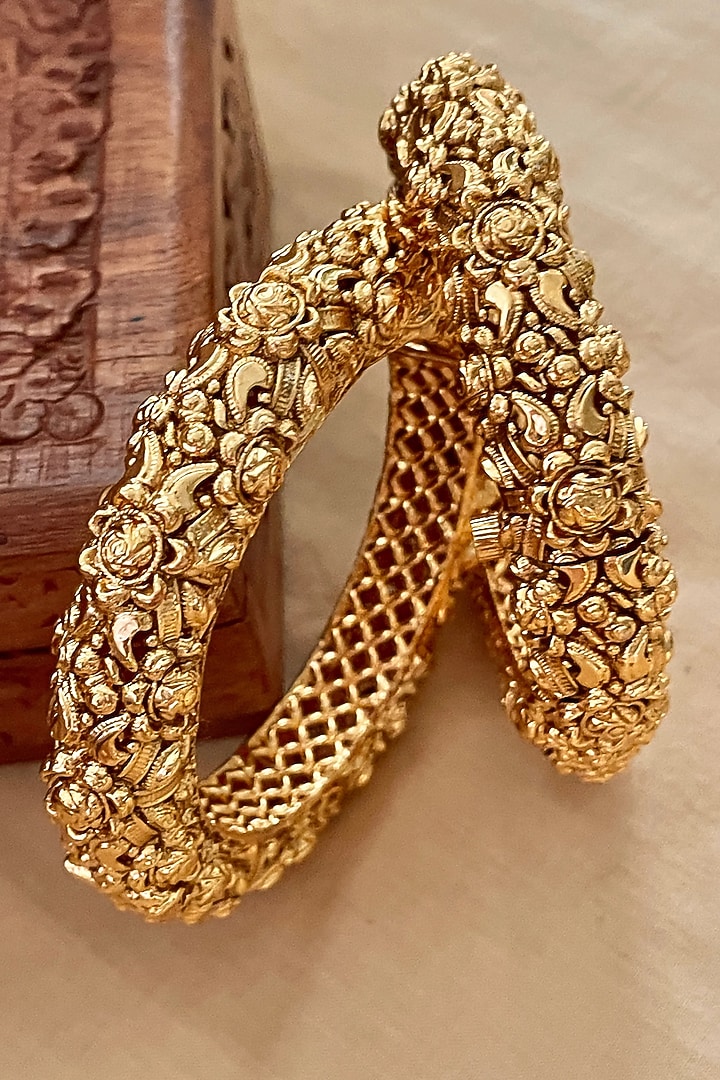 Gold Finish Temple Carved Bangles (Set Of 2) by Saga Jewels at Pernia's Pop Up Shop