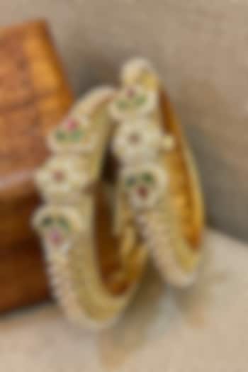 Gold Finish Temple Textured Bangles (Set Of 2) by Saga Jewels at Pernia's Pop Up Shop