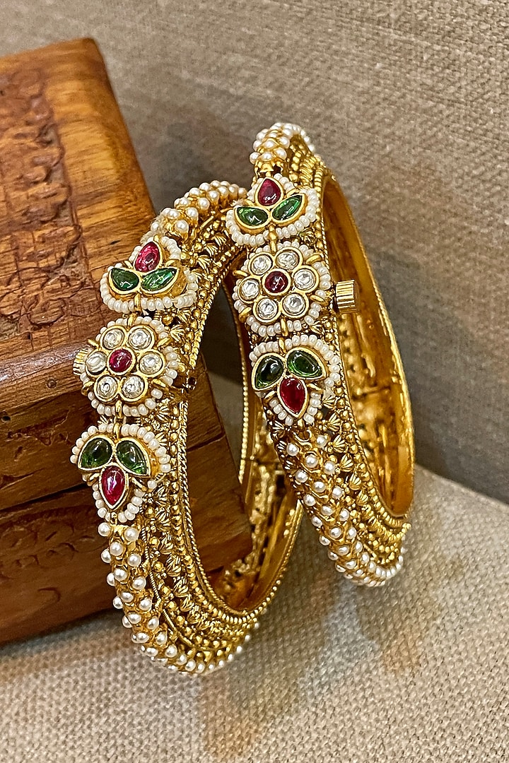 Gold Finish Temple Textured Bangles (Set Of 2) by Saga Jewels at Pernia's Pop Up Shop