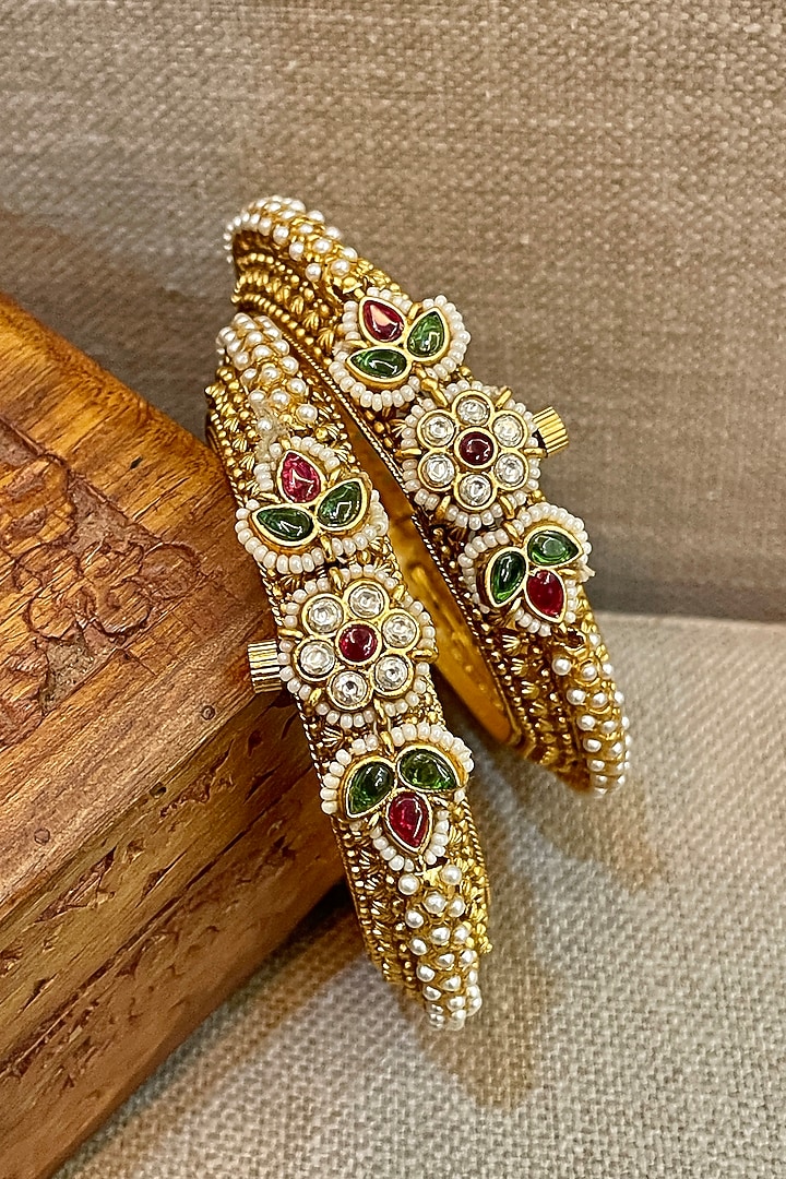 Gold Finish Temple Textured Bangles (Set Of 2) by Saga Jewels at Pernia's Pop Up Shop