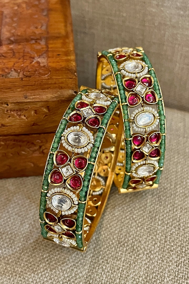 Gold Finish Green Beaded Bangles (Set Of 2) by Saga Jewels at Pernia's Pop Up Shop