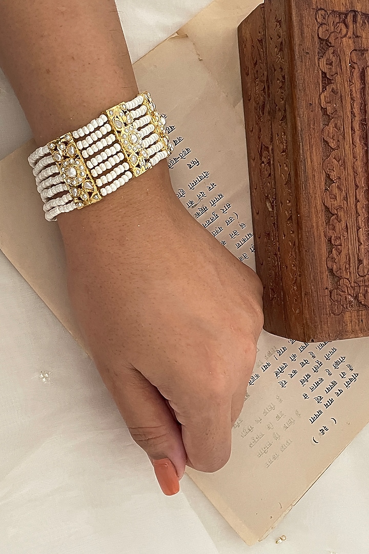 Gold Finish Pearl Bracelet by Saga Jewels at Pernia's Pop Up Shop