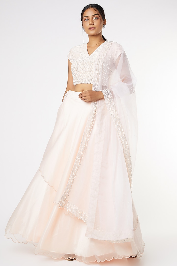 Peach Layered Wedding Lehenga Set by Saloni Jain at Pernia's Pop Up Shop