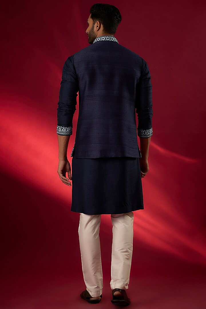 Navy Blue Raw Silk Hand & Machine Embroidered Bundi Jacket Set by SAMMOHAN at Pernia's Pop Up Shop