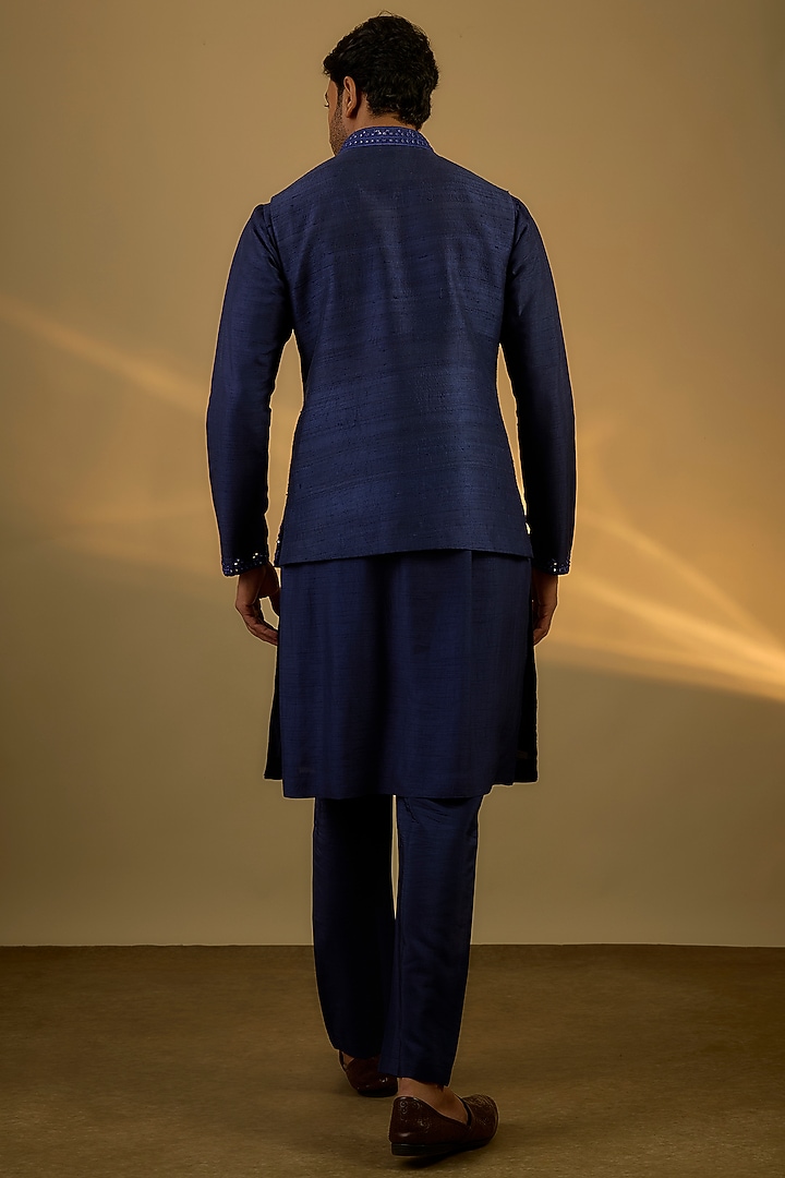 Navy Blue Raw Silk Hand & Machine Embroidered Bundi Jacket Set by SAMMOHAN at Pernia's Pop Up Shop