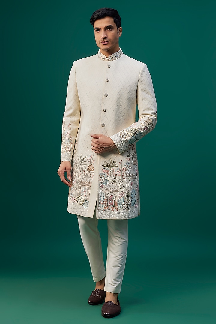 Ivory Raw Silk Resham Hand & Machine Embroidered Sherwani Set by SAMMOHAN