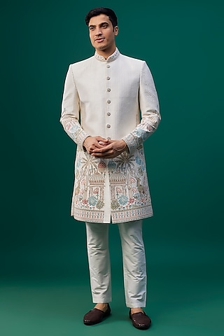 Ivory Raw Silk Resham Hand & Machine Embroidered Sherwani Set by SAMMOHAN