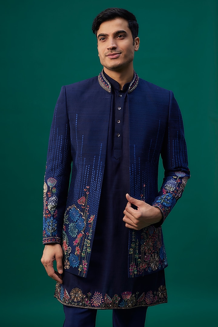 Navy Blue Raw Silk Resham Hand & Machine Embroidered Groom Indowestern Set by SAMMOHAN at Pernia's Pop Up Shop