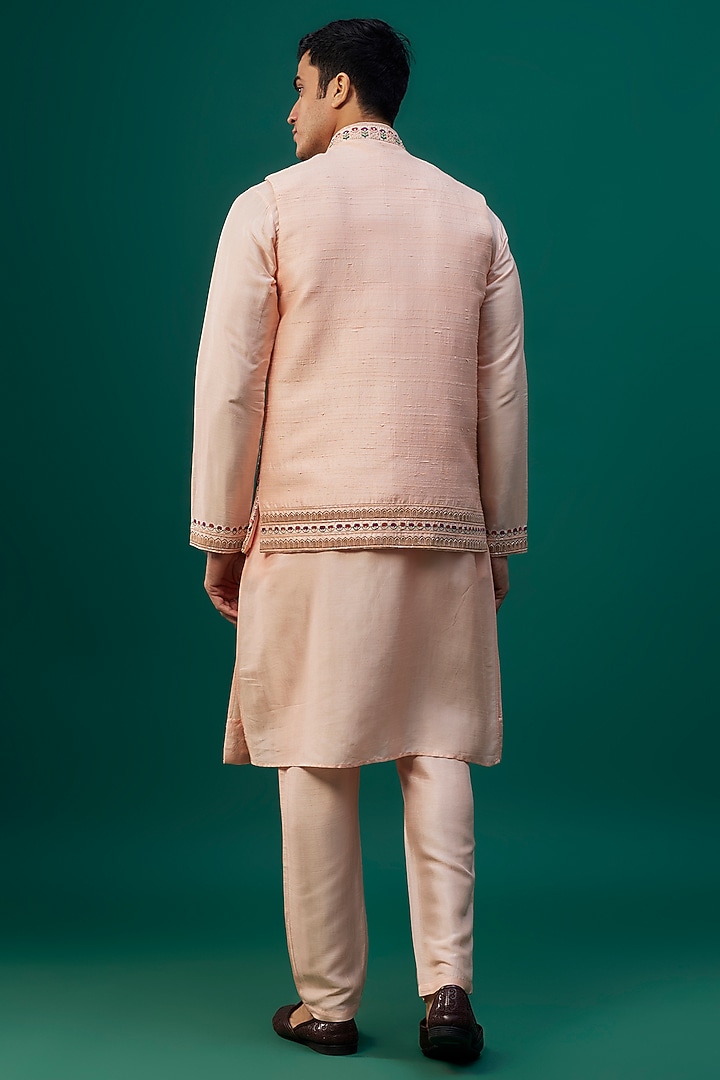 Peach Raw Silk Resham Hand & Machine Embroidered Bundi Jacket Set by SAMMOHAN at Pernia's Pop Up Shop