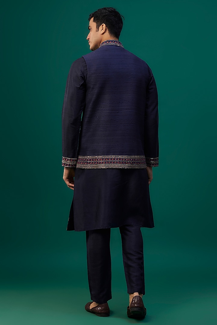 Navy Blue Raw Silk Resham Hand & Machine Embroidered Bundi Jacket Set by SAMMOHAN at Pernia's Pop Up Shop