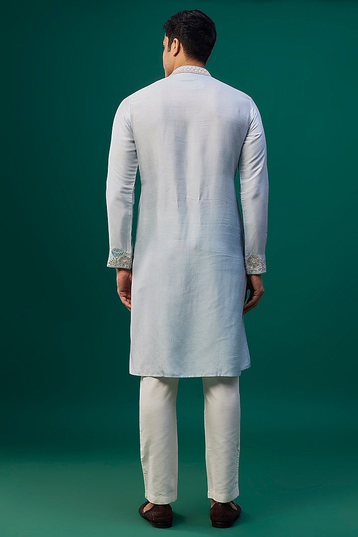 Powder Blue Tussar Resham Hand & Machine Embroidered Kurta Set by SAMMOHAN at Pernia's Pop Up Shop