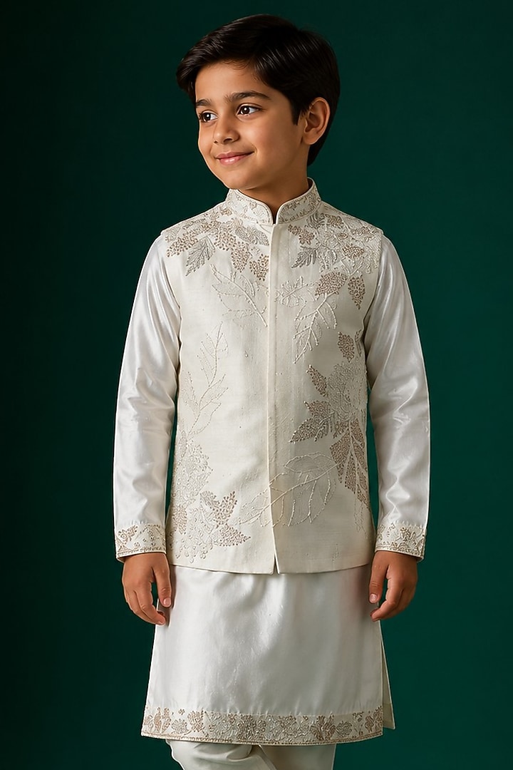 Ivory Tussar & Raw Silk Embroidered Bundi Jacket Set For Boys by Sammohan Kids at Pernia's Pop Up Shop
