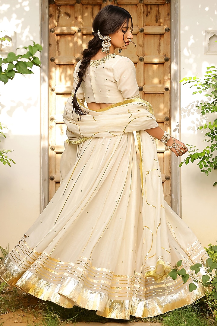 Ivory Soft Chanderi Zardosi & Mirror Embroidered Kalidar Lehenga Set by SANAM at Pernia's Pop Up Shop