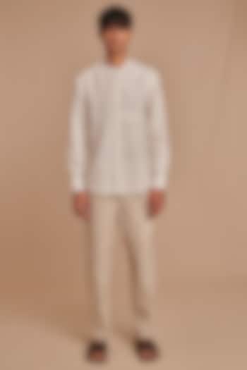 Off-White Pure Linen Tapered High-Waisted Trousers by Saphed Men