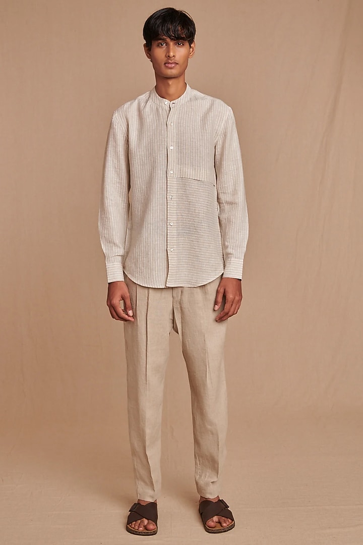 Off-White Pure Linen Tapered High-Waisted Trousers by Saphed Men