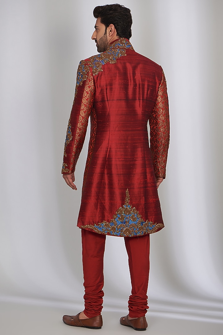 Powder Red Pure Raw Silk Embroidered Groom Sherwani Set by SARAN KOHLI at Pernia's Pop Up Shop