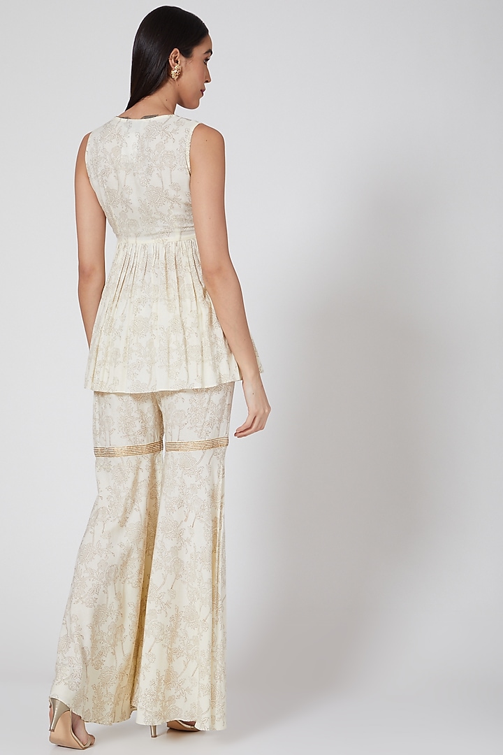 Cream Hand Embroidered Sharara Set by Samatvam By Anjali Bhaskar at Pernia's Pop Up Shop