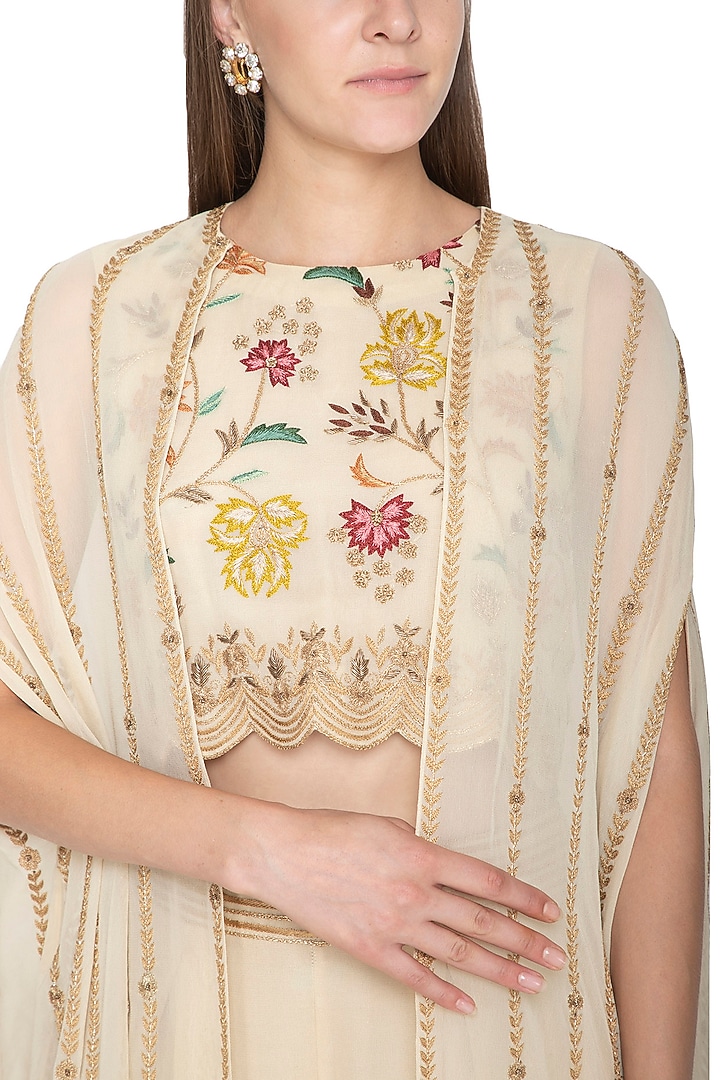 Ivory Embroidered Crop Top With Pants & Cape by Samatvam By Anjali Bhaskar at Pernia's Pop Up Shop
