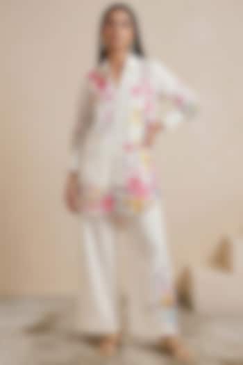 Off-White Linen Floral Motif Printed Pants by Satya Paul at Pernia's Pop Up Shop