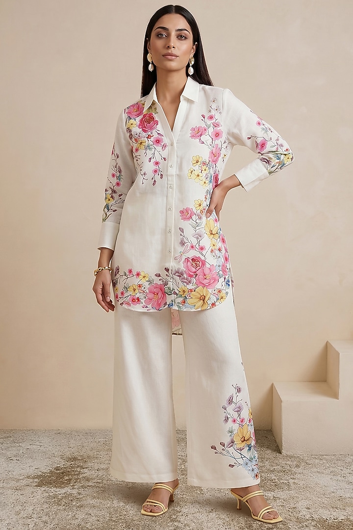 Off-White Linen Floral Motif Printed Pants by Satya Paul at Pernia's Pop Up Shop