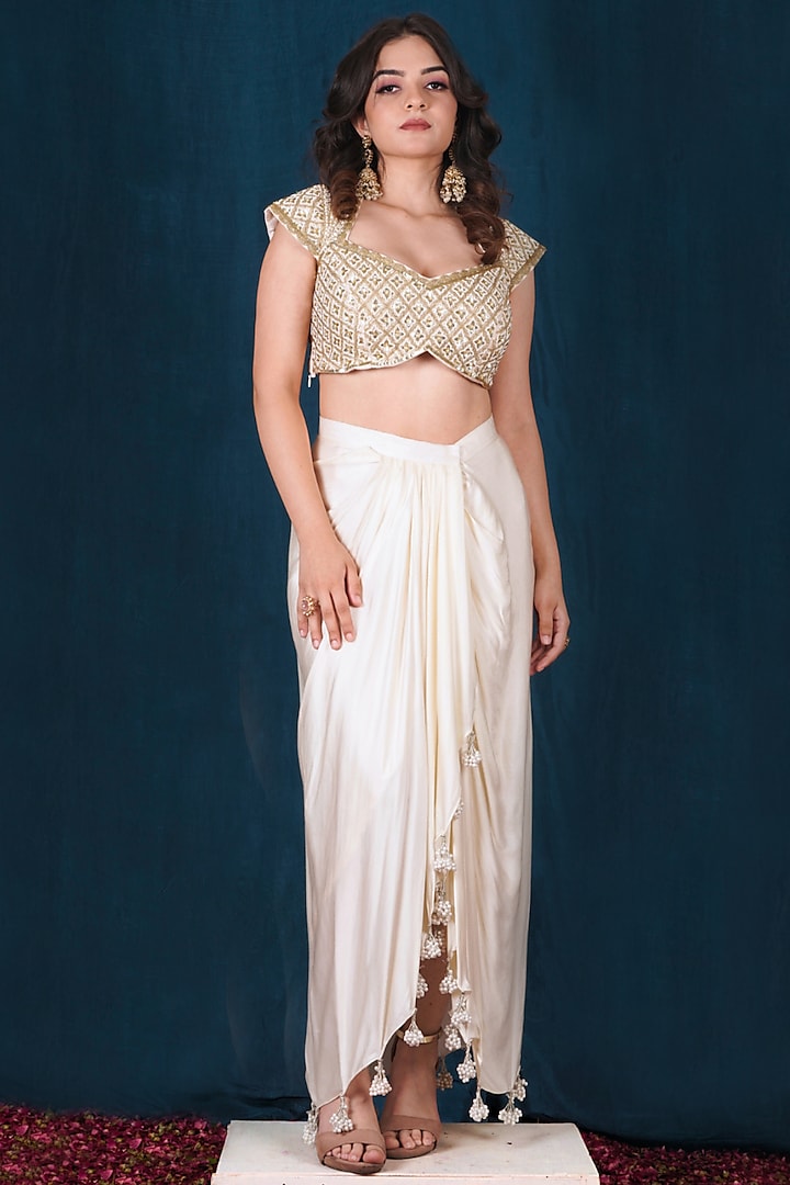 Off-White Modal Satin Sequins Embroidered Draped Skirt Set by SAUBHAGYA