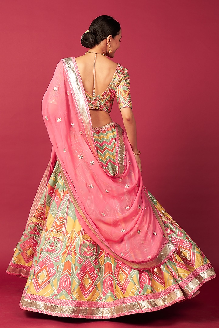 Pink Raw Silk Chevron Printed & Mirror Work Wedding Lehenga Set by Saundh at Pernia's Pop Up Shop