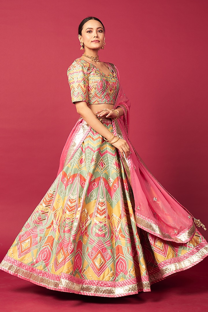 Pink Raw Silk Chevron Printed & Mirror Work Wedding Lehenga Set by Saundh at Pernia's Pop Up Shop
