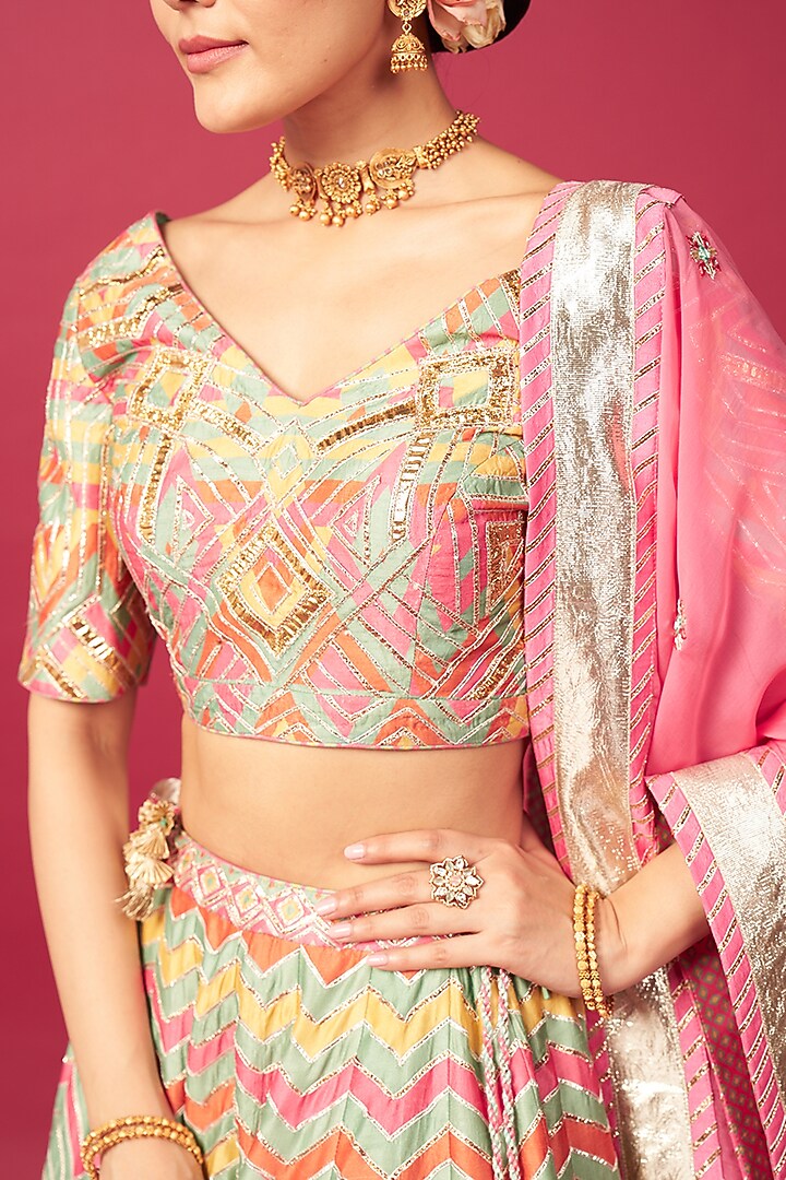 Pink Raw Silk Chevron Printed & Mirror Work Wedding Lehenga Set by Saundh at Pernia's Pop Up Shop